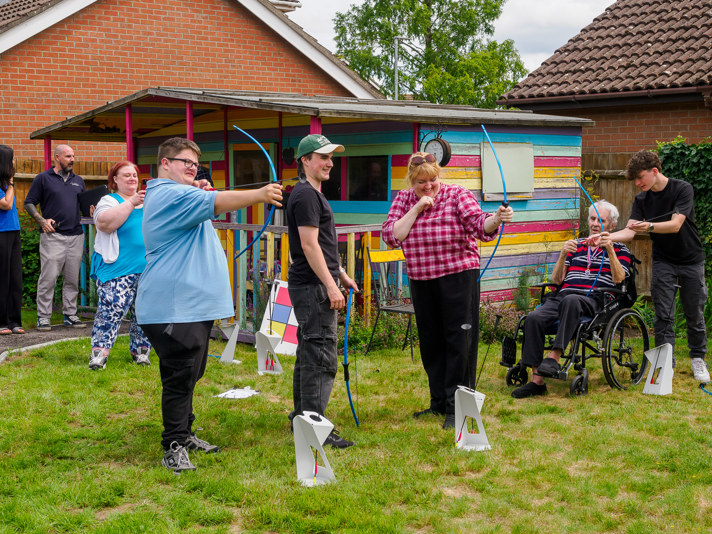 Care home residents doing soft archery